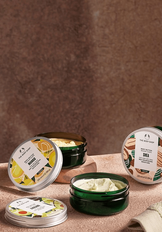 Mango Body Butter de The Body Shop junto con otras cremas de la marca.